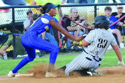 Alina Jones slides under a tag during the Holdenville game.