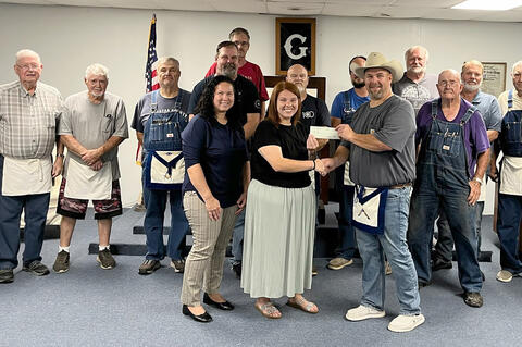 The Allen Masonic Lodge donated the proceeds of their fund raiser for Hailey Ellis recently. Ms. Elllis was the victim of a house fire that totaled her home and possessions. l-r Charles Speir, Bob Biggs, Ron Britt, Fred Price, Eric Martin, Ron Anderson, D
