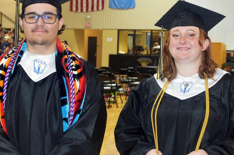 Rocky Brown and Breanna Nester pose at graduation.
