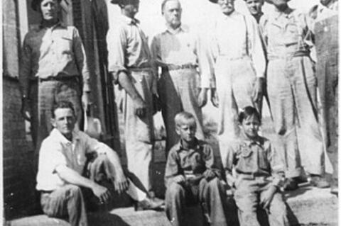 Centahoma men and boys waiting on the Bus to Coalgate….Center right is Mr. Shoffit. Can you name any? Photo of Smiths Store and bus station.