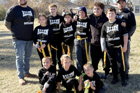 The Allen Outlaws brought home the gold ball in the Inaugural season of Flag Football in Allen. Pictured are Coach D’Ambrey Hubbard, Sophie Martin, Travis, Maddox Barfield, D’andre Hubbard, Jase Johnson,VanShires Kevin Martin, front Hudson Martin, Col