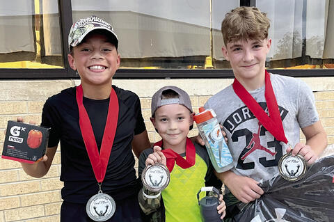These three runners were the fastest survivors in the Zombie Run: D’Andre Hubbard, Wyatt Heck and two year champion Tyson Lindsey