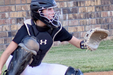 Kayla Nickell handles the catching duties for the Lady Mustangs.