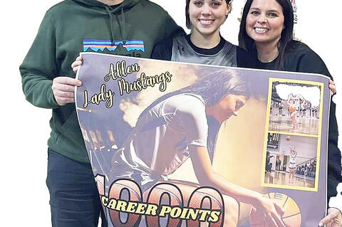 Congratulations to Junior Cherish Woodward for scoring her 1,000 point last week. She is pictured with her parents Calem and Latisha Woodward.