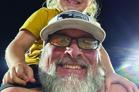 Carl Frederick and his granddaughter Graycee Bryen cheering on the Mustangs at a recent game.