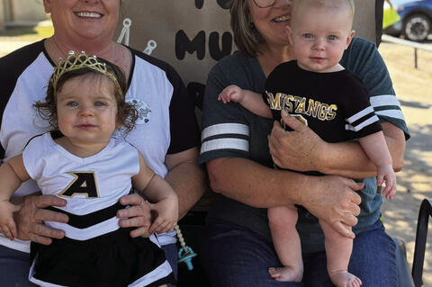 Lowen Garner and Asher Mudd, future homecoming royalty were chauffered in the parade by their grandmothers, Shannon and Jessica.
