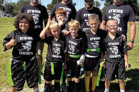 The Atwood Cowboys won the covetted championship trophy for their age group flag football team. front: Legend, Colt, Cooper, Jace, Kaxton, Kayron middle. Coaches Jerry, Kile, Cody and Nick