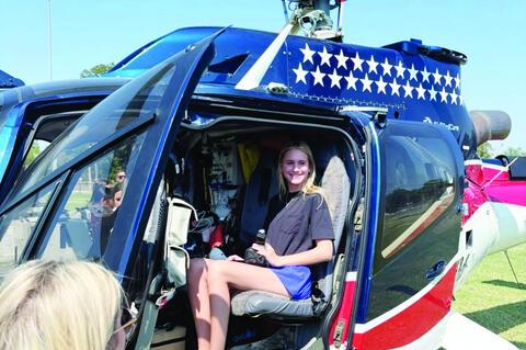 Allen senior Lily Laden gets a close up look at the Air Evac helicopter
