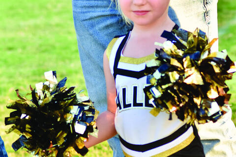 Lily Dickerson proudly cheers on the Mustangs