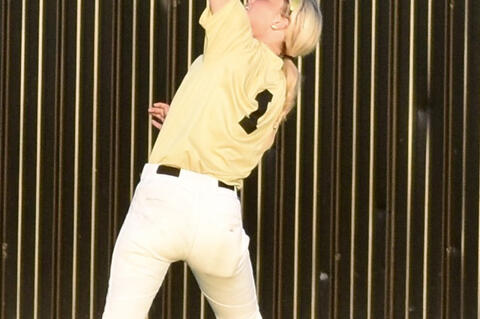 Senior Centerfielder Tresley Mowdy makes an over the shoulder grab in a recent game.