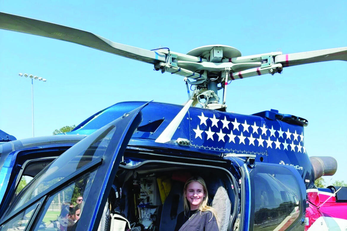 Allen senior Lily Laden gets a close up look at the Air Evac helicopter