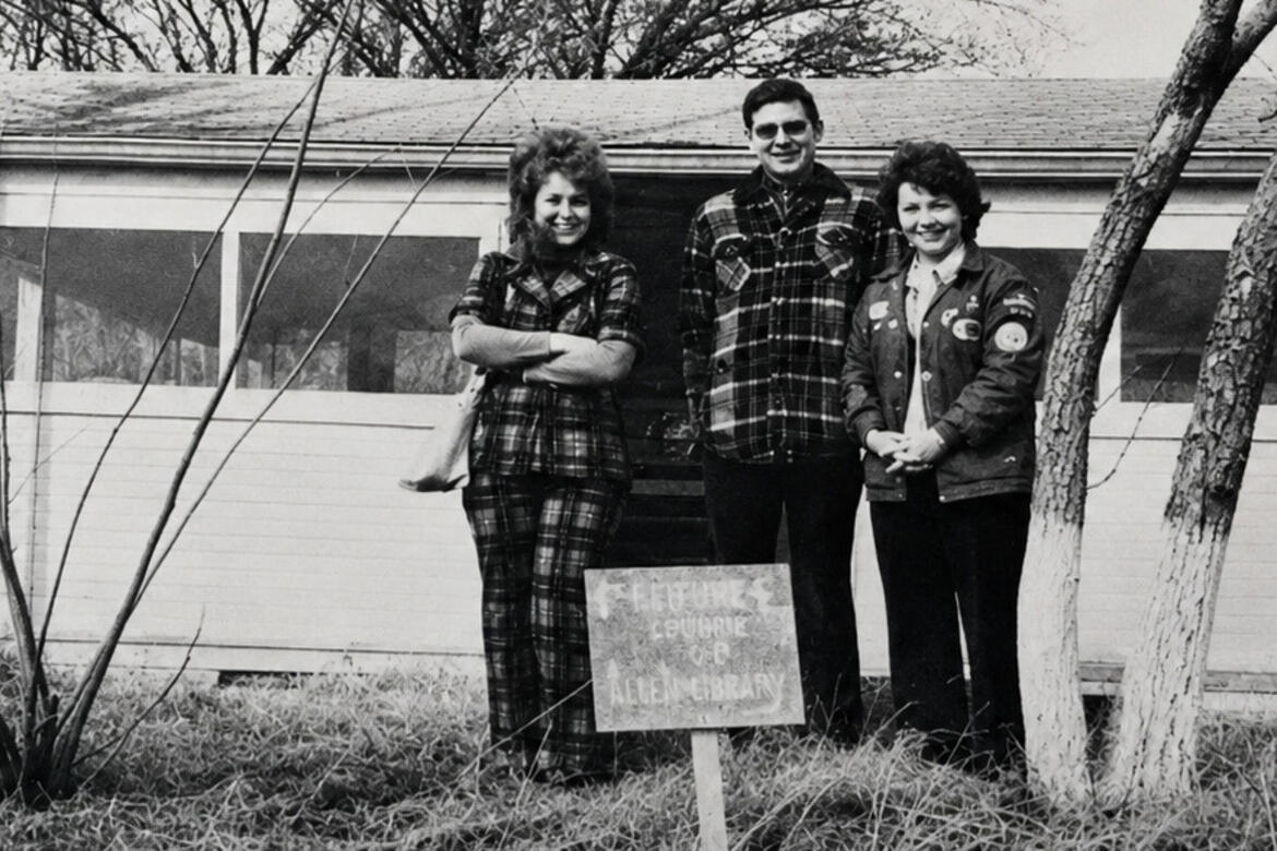 In 1976 the Allen library was established, this picture from then shows Fran Butler, Charles Speri and Sue Edwards as the Library Committee in front of the first building.