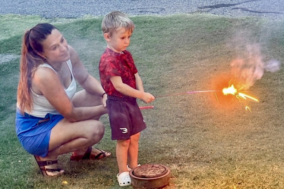 Alycia Napier showed her son, Krew, the finer points of lighting fireworks as they enjoyed celebrating the Fourth of July.