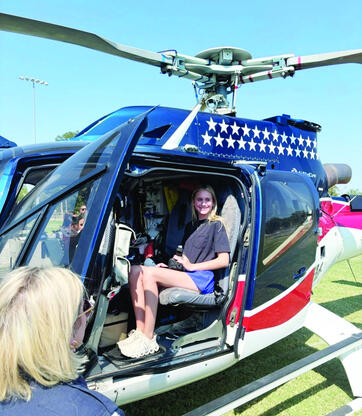 Allen senior Lily Laden gets a close up look at the Air Evac helicopter