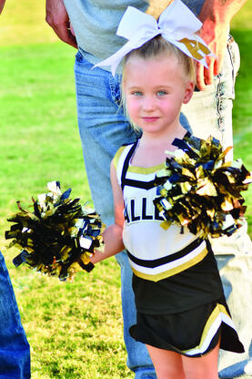 Lily Dickerson proudly cheers on the Mustangs