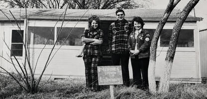 In 1976 the Allen library was established, this picture from then shows Fran Butler, Charles Speri and Sue Edwards as the Library Committee in front of the first building.