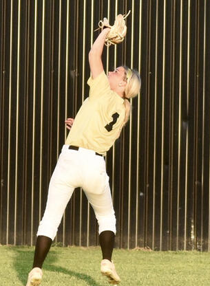 Senior Centerfielder Tresley Mowdy makes an over the shoulder grab in a recent game.