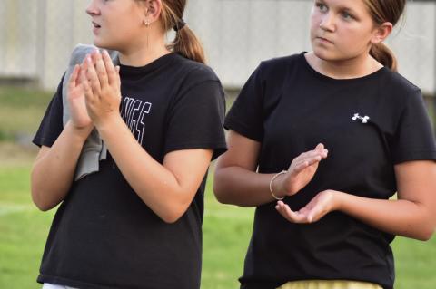 Ryn Parker and McKenzie Johnson cheering on the Mustangs