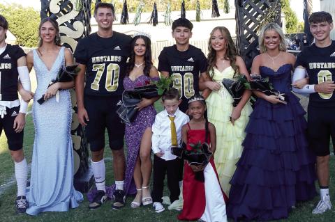 Homecoming Royalty 2025 - seniors Ethan Smith and Emma Tomb; sophomores Nate Boeck and queen Caityn Williams; freshmen Mario Gonzalez and Kolbi Clark; and juniors Tresley Mowdy and Briar Heck. Pictured front are crownbearer Lincoln Griffith and flowergirl