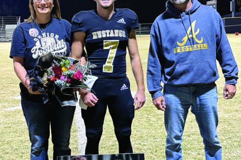 Kayd Bell and his parents Mindi and Frankie
