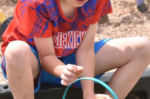 Marco Morena and Tracey Winguard race for eggs at the first grade hunt.