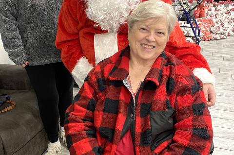 Linda Knighten got a chance to visit with Santa while she was attending the Heritage Village Christmas party.