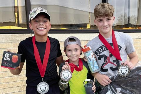 These three runners were the fastest survivors in the Zombie Run: D’Andre Hubbard, Wyatt Heck and two year champion Tyson Lindsey