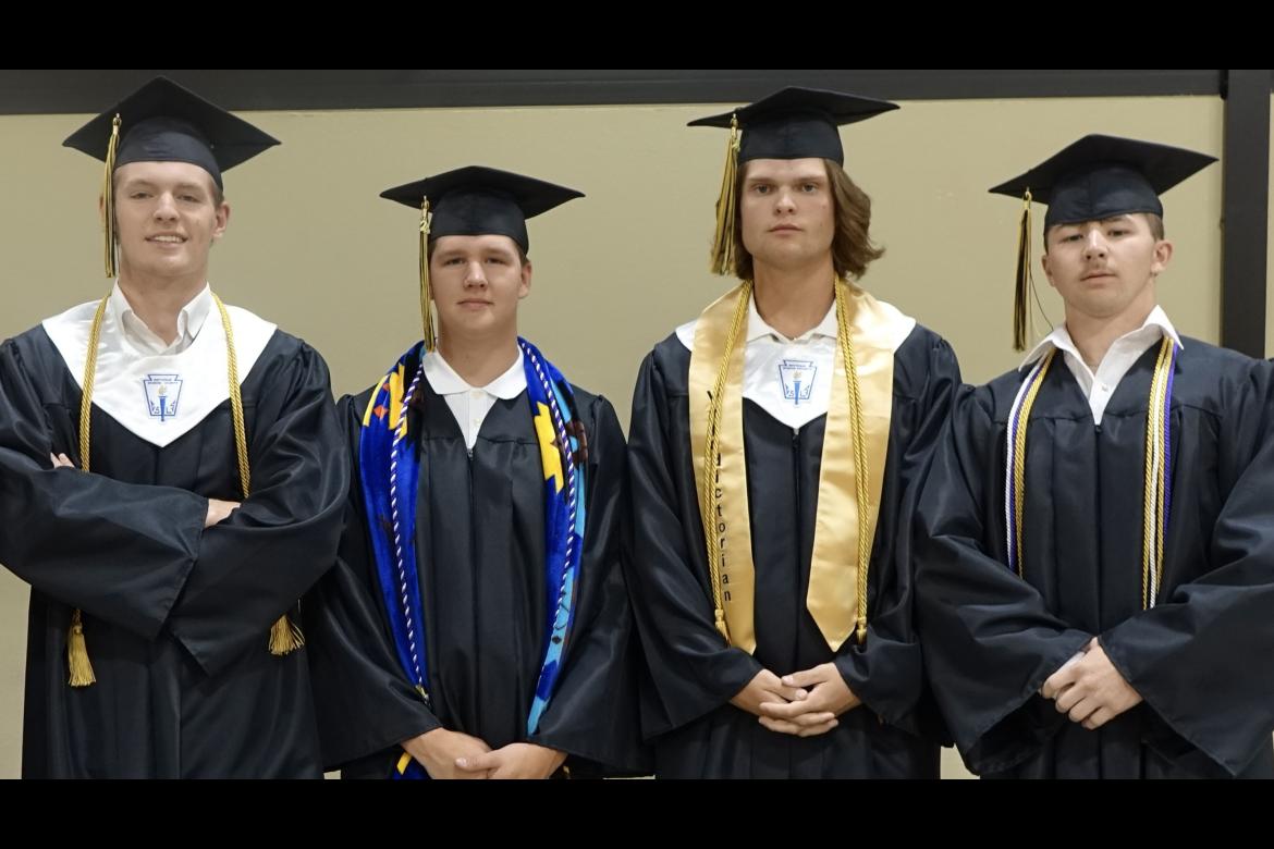 Easton Ledo, Lance Johnson, Jack Todd and Emmett Koonce before graduation last Friday.