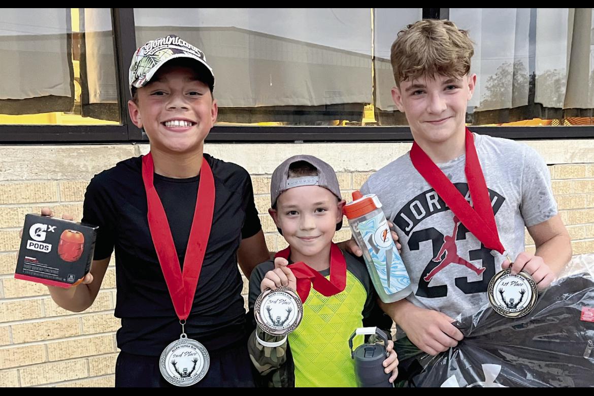 These three runners were the fastest survivors in the Zombie Run: D’Andre Hubbard, Wyatt Heck and two year champion Tyson Lindsey